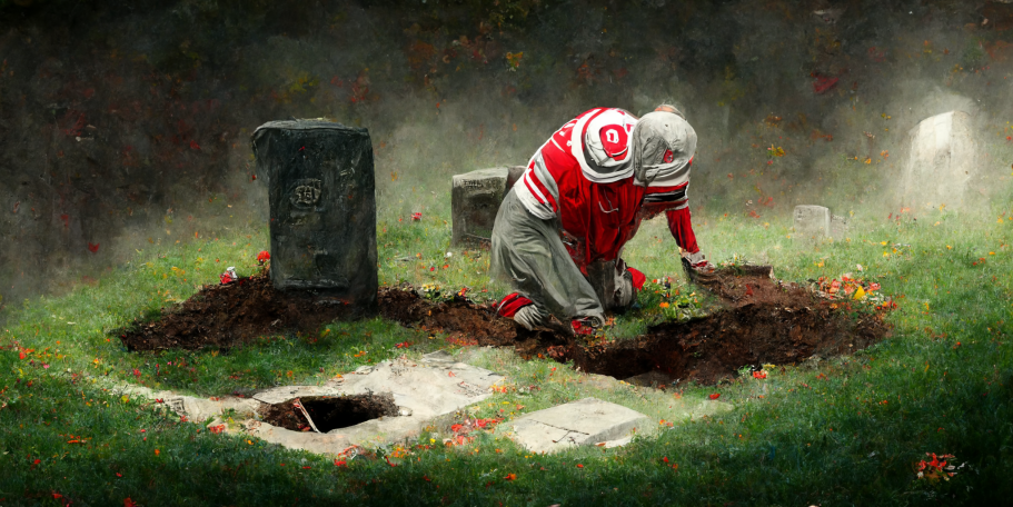 Brutus Buckeye dabbing on an open grave